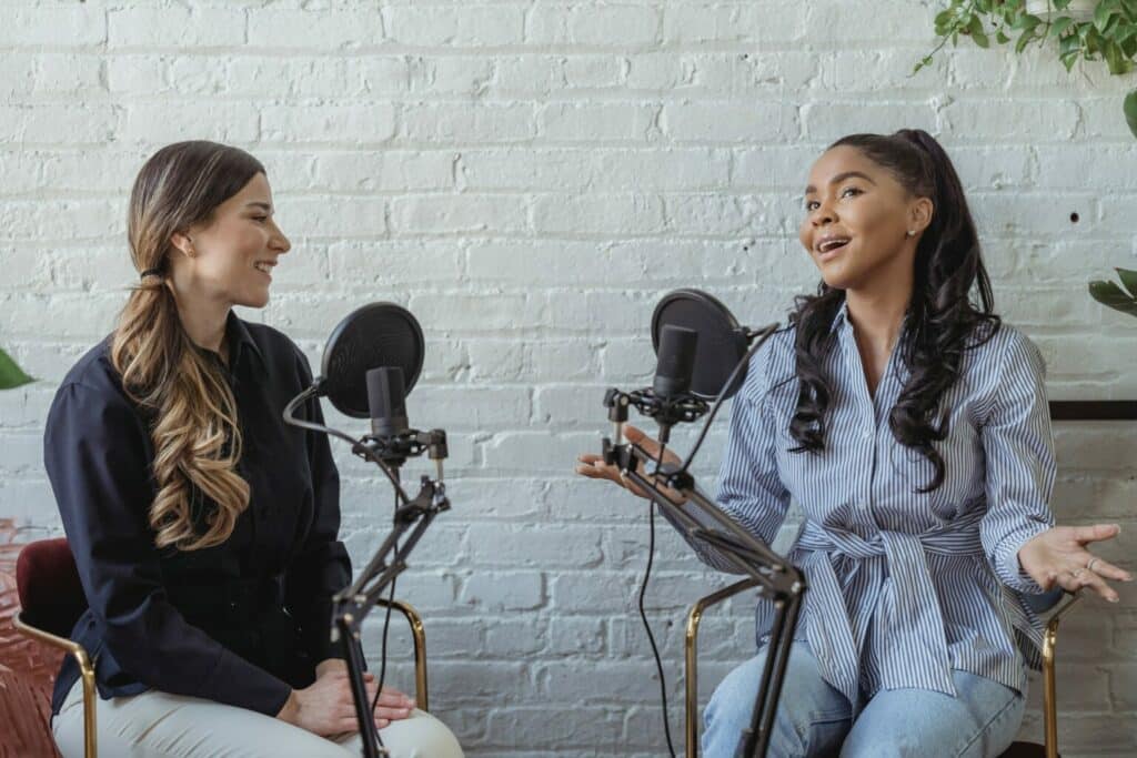 two females in a podcast